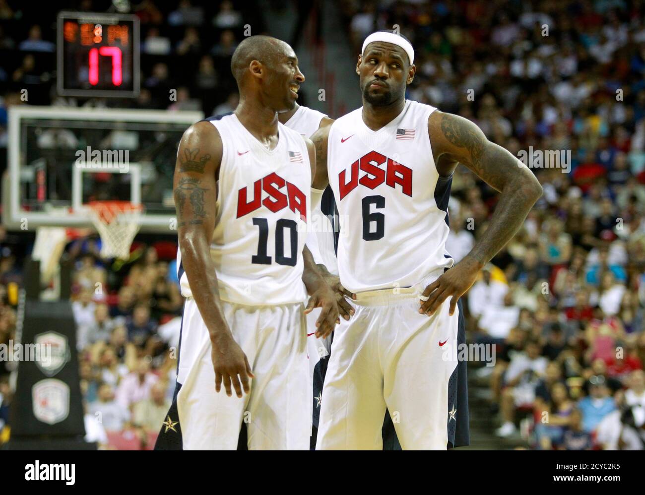 Kobe Bryant L Of The U S 12 Olympic Men S Basketball Team Walks Past His Teammate Lebron James During Their Exhibition Game Against The Dominican Republic At The Thomas Mack Center In