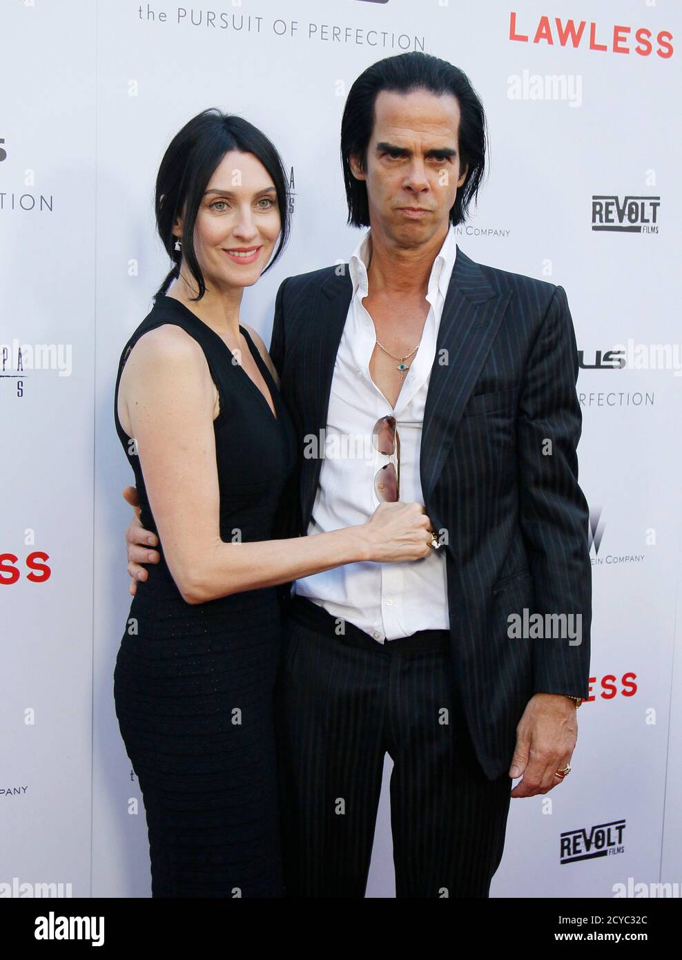 Writer and composer Nick Cave (R) and his wife Susie Bick pose at the  premiere of the film 