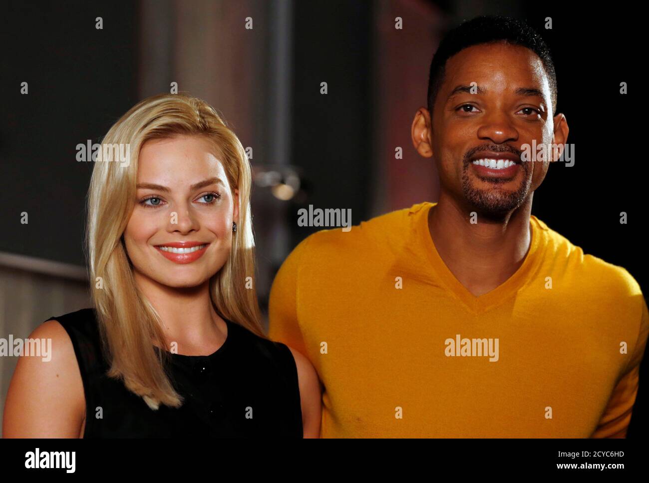 U S Actor Will Smith R And Actress Margot Robbie Pose During A Photo Call For The Movie 
