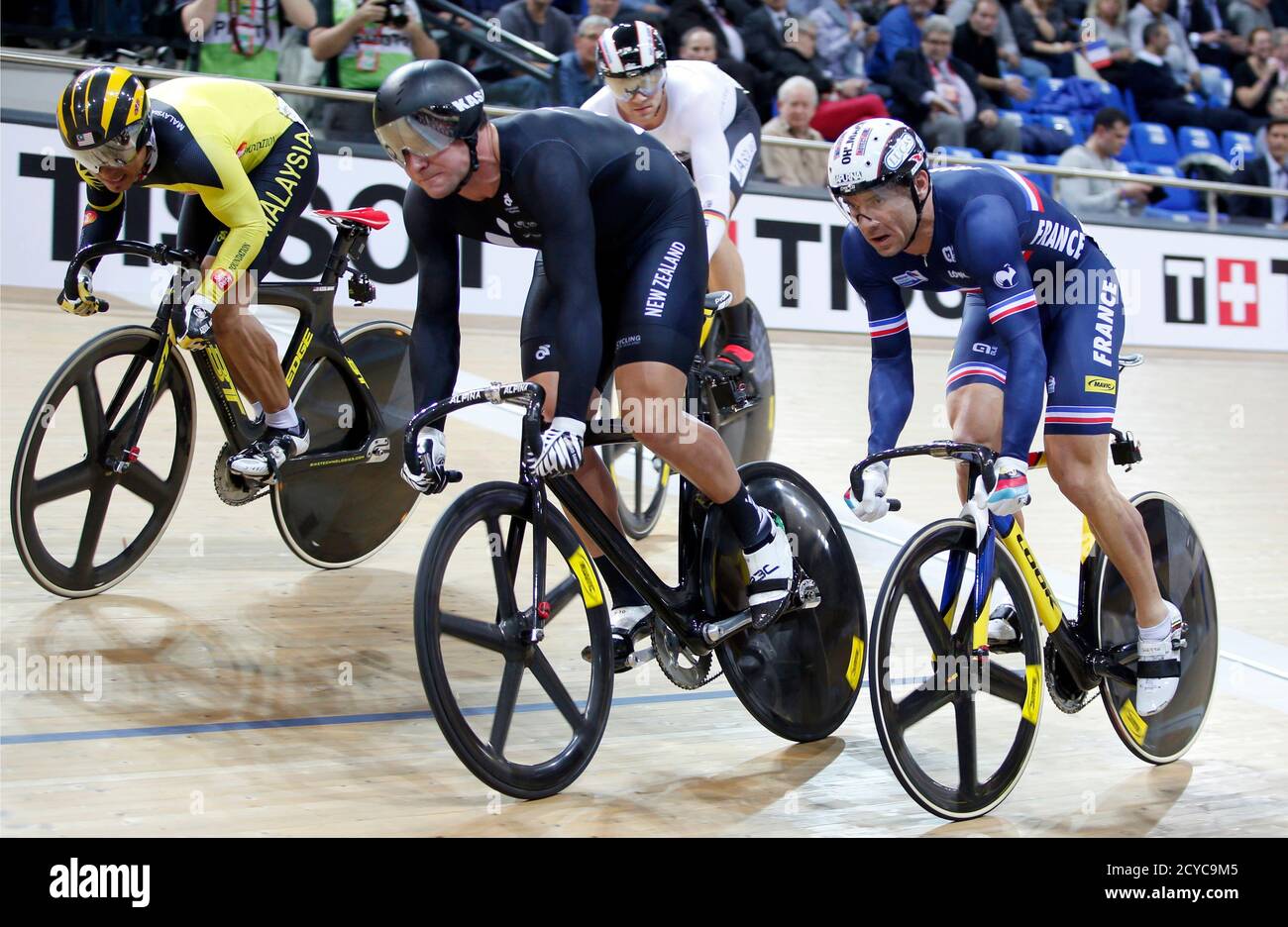 Azizulhasni Awang Of Malaysia Who Placed Third New Zealand S Edward Dawkins Who Came Second And Winner Francois Pervis L R Of France Compete In The Men S Keirin Track Cycling Event At The Uci