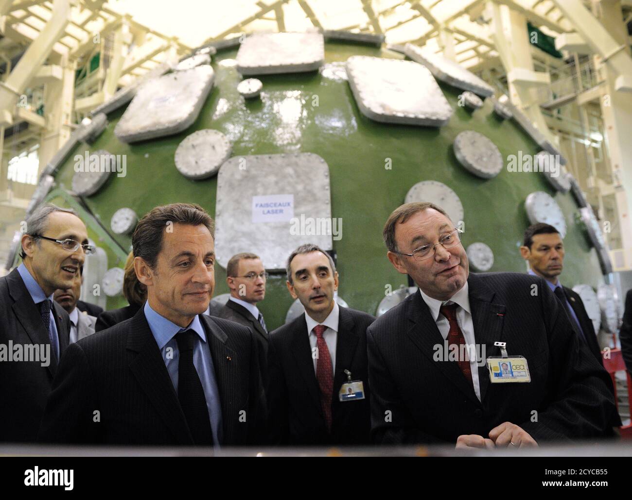 France's President Nicolas Sarkozy (2nd L) listens the CEA site director  Daniel Verwaerde (R) as he visits the experience of the Megajoule Laser  (LMJ) project of the French Atomic Energy and Alternative