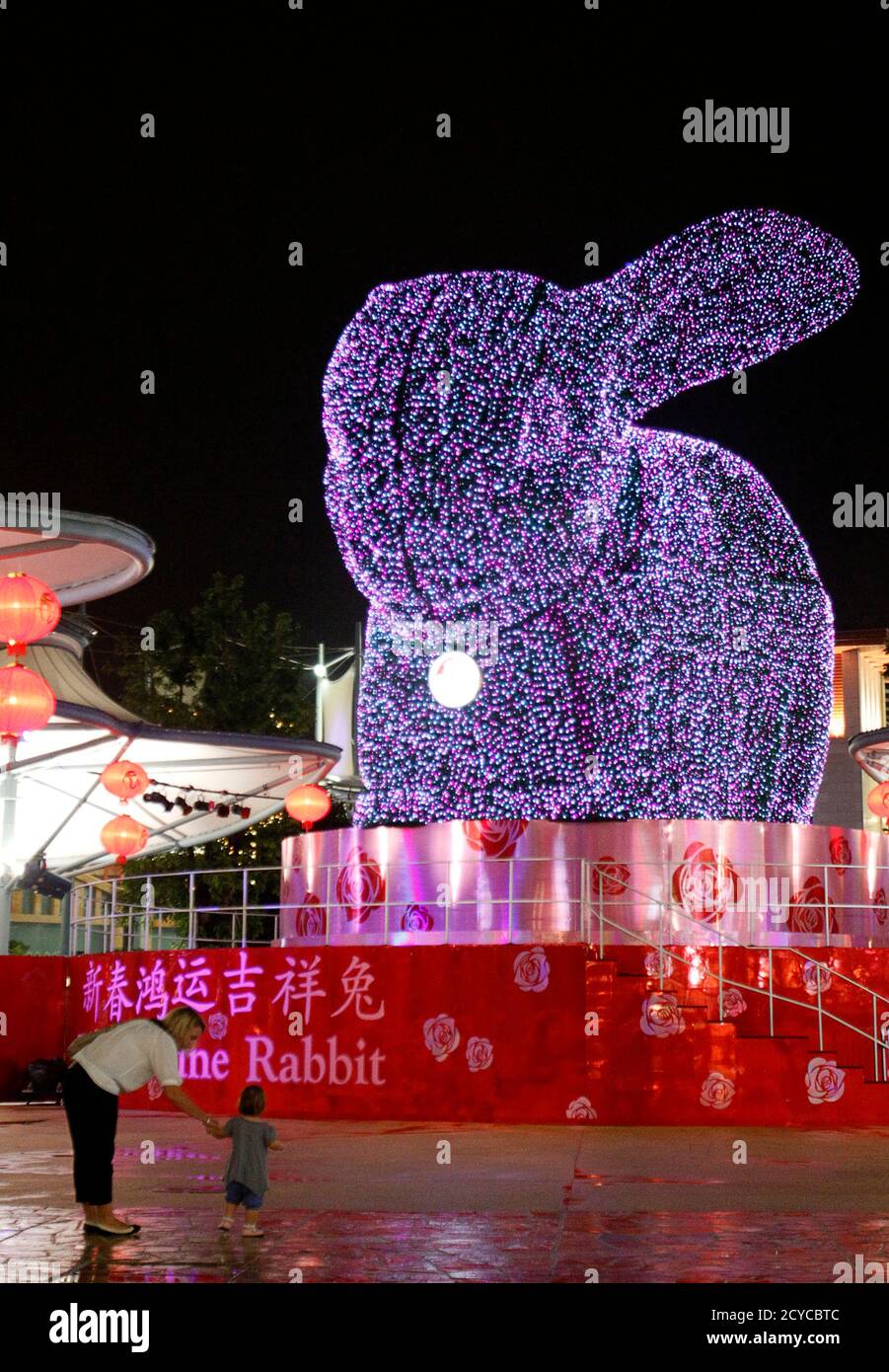 https www alamy com a mother and her daughter stand in front of a four storey high topiary rabbit at resorts world sentosa in singapore january 30 2011 displayed as part of decorations to welcome the upcoming lunar new year the lunar new year begins on february 3 and marks the start of the year of the rabbit according to the chinese zodiac reutersalywin chew singapore tags society image378286172 html