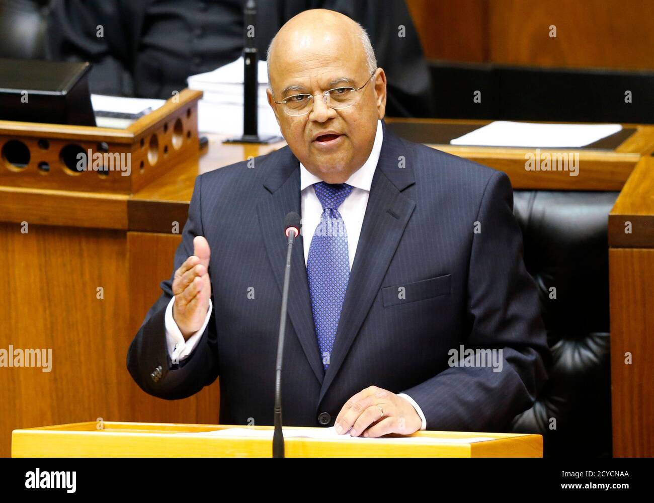 South Africa's Finance Minister Pravin Gordhan delivers his 2014 budget address at Parliament in Cape Town February 26, 2014. South Africa cut this year's growth forecast to 2.7 percent, saying deep challenges persisted after a 2009 recession and warning that delays to new infrastructure, especially in the power sector, posed risks to the continent's largest economy. REUTERS/Mike Hutchings (SOUTH AFRICA - Tags: POLITICS BUSINESS) Stock Photo