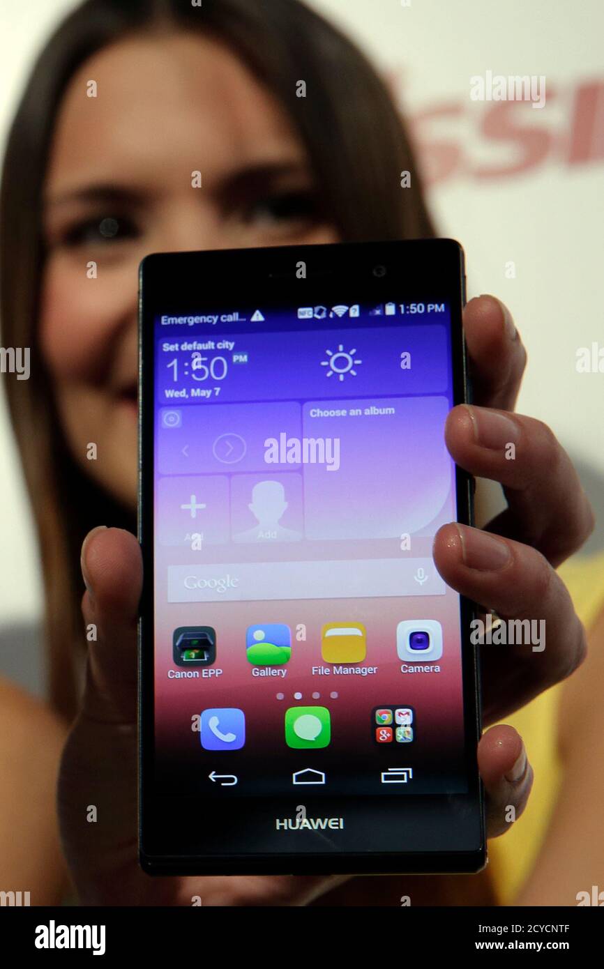 An hostess holds the Huawei's new smartphone, the Ascend P7, launched by  China's Huawei Technologies during a presentation in Paris, May 7, 2014.  The mobile - billed as the world's slimmest phone