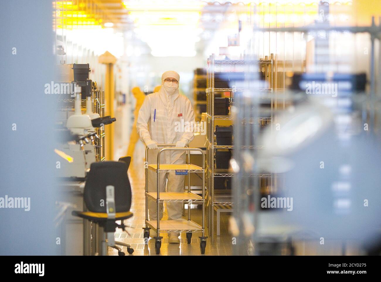 An employee works on the production of high-power semiconductors at a  manufacturing plant of Swiss engineering group ABB in Lenzburg, May 30,  2012. Power semiconductors are switching devices that control the flow