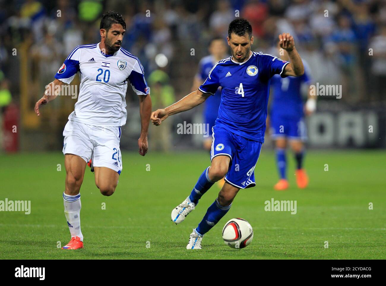 Bosnia S Emir Spahic Fights For The Ball Against Israel S Omri Ben Harush L During Their Euro 16 Qualifying Soccer Match In Zenica Bosnia And Herzegovina June 12 15 Reuters Dado Ruvic Stock Photo Alamy