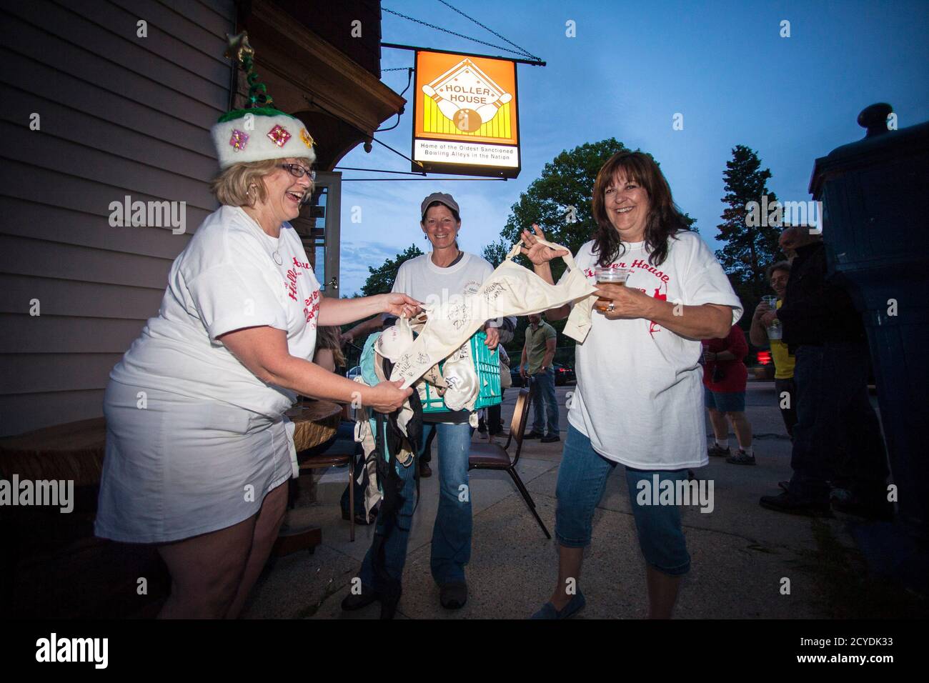 Patrons of the Holler House bar participate in the Great Bra Rehanging  event in Milwaukee, Wisconsin June 14, 2013. A Milwaukee city inspector had  in April ordered Holler House's owner Marcy Skowronski