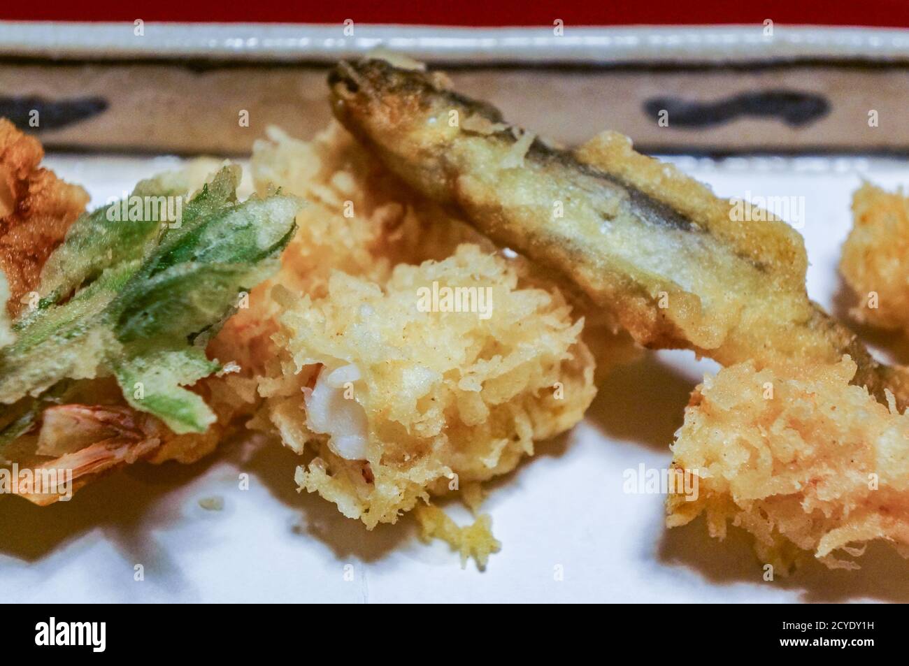 Small fish and vegetable tempura, traditional kaiseki food served at a