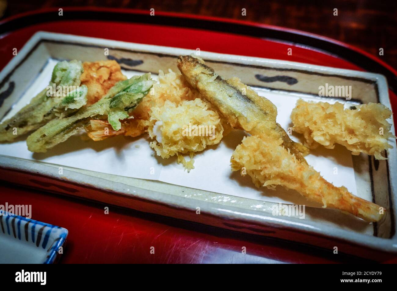 Small fish and vegetable tempura, traditional kaiseki food served at a