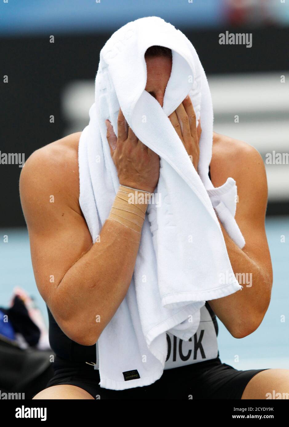 Brent Newdick of New Zealand wipes his face with a towel during the shot  put event of the men's decathlon at the IAAF World Championships in Daegu  August 27, 2011. REUTERS/Phil Noble (