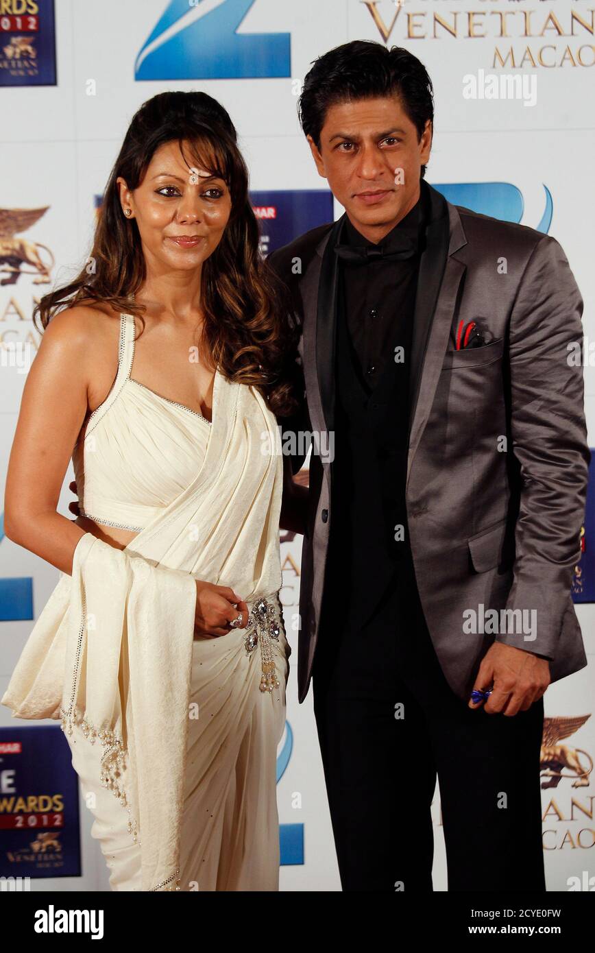 Indian actor Shah Rukh Khan and his wife Gauri pose at the red carpet during the Zee Cine Awards in Macau January 21, 2012. REUTERS/Bobby Yip (CHINA - Tags: ENTERTAINMENT) Stock Photo