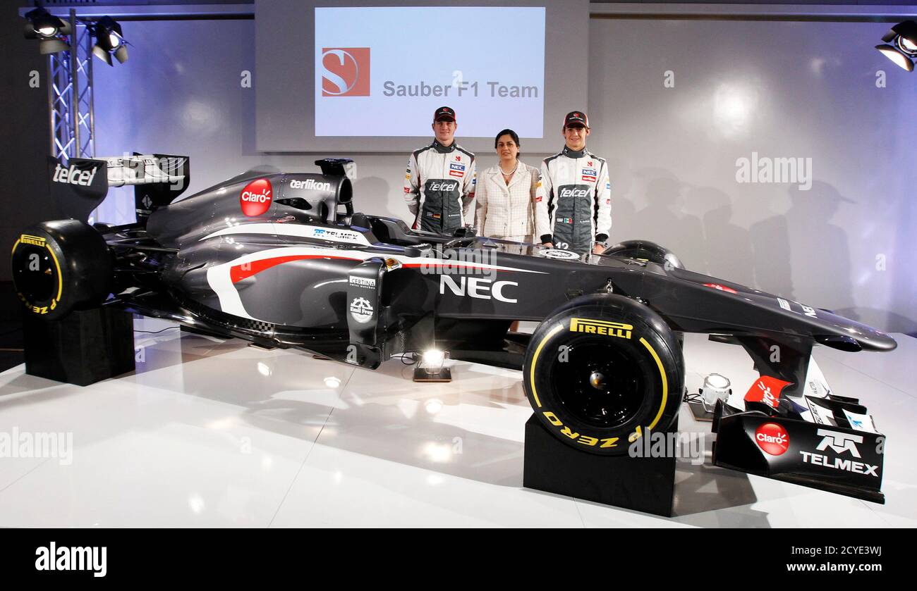 sauber formula one team principal monisha kaltenborn c poses with f1 drivers nico hulkenberg l of germany and esteban gutierrez of mexico after unveiling the c32 ferrari car at the company s headquarters in