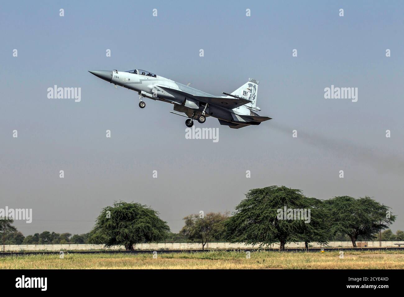 A JF-17 Thunder fighter jet of the Pakistan Air Force takes off from Mushaf base in Sargodha, north Pakistan June 7, 2013. The plane is co-developed by the Aviation Industry Corp of China and the Pakistan Aeronautical Complex, according to local media. Picture taken June 7, 2013. REUTERS/Zohra Bensemra (PAKISTAN - Tags: MILITARY) Stock Photo