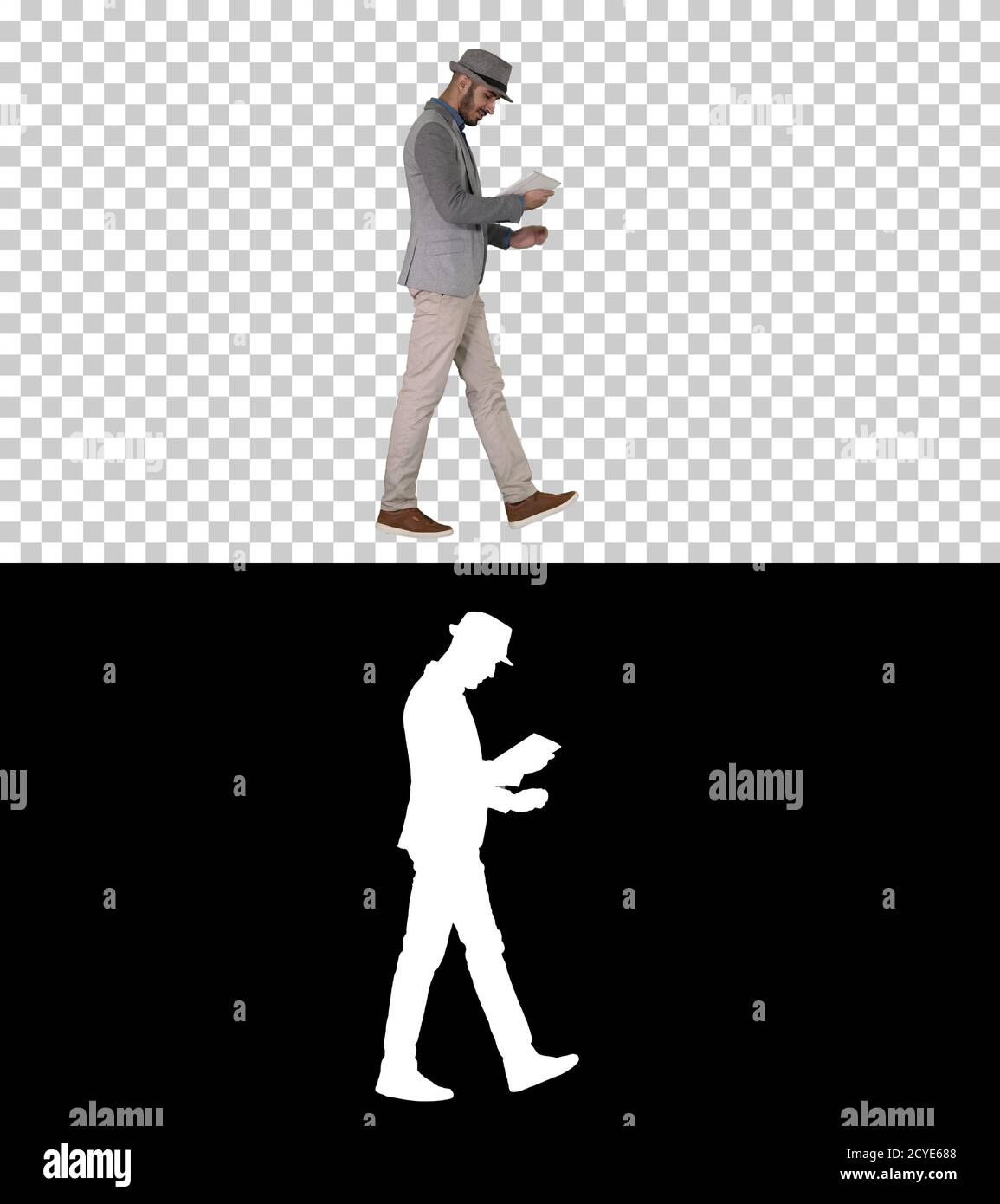 Casual man using tablet and smiling while waking, Alpha Channel Stock Photo