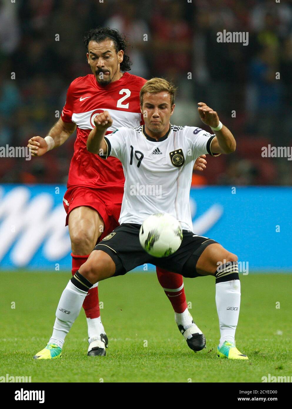 Germany's Mario Gotze (R) challenges Turkey's Servet Cetin during their Euro 2012 qualifying Group A soccer match at Turk Telekom Arena in Istanbul October 7, 2011. REUTERS/Murad Sezer (TURKEY  - Tags: SPORT SOCCER) Stock Photo