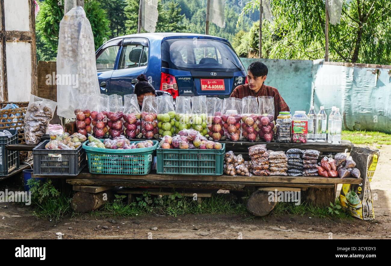 Fruit stall by the road in Thimphu, Bhutan, selling apples and groceries Stock Photo