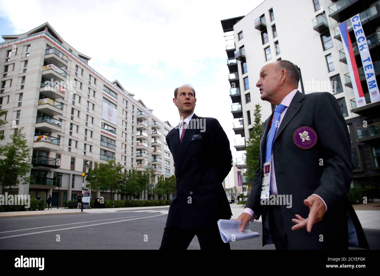 Britain's Prince Edward (L) chats with village mayor Charles Allen during a tour of the Athletes' Village at the Olympic Park in London,  July 19, 2012.    REUTERS/Jae C. Hong/Pool (BRITAIN - Tags: SPORT OLYMPICS ROYALS) Stock Photo