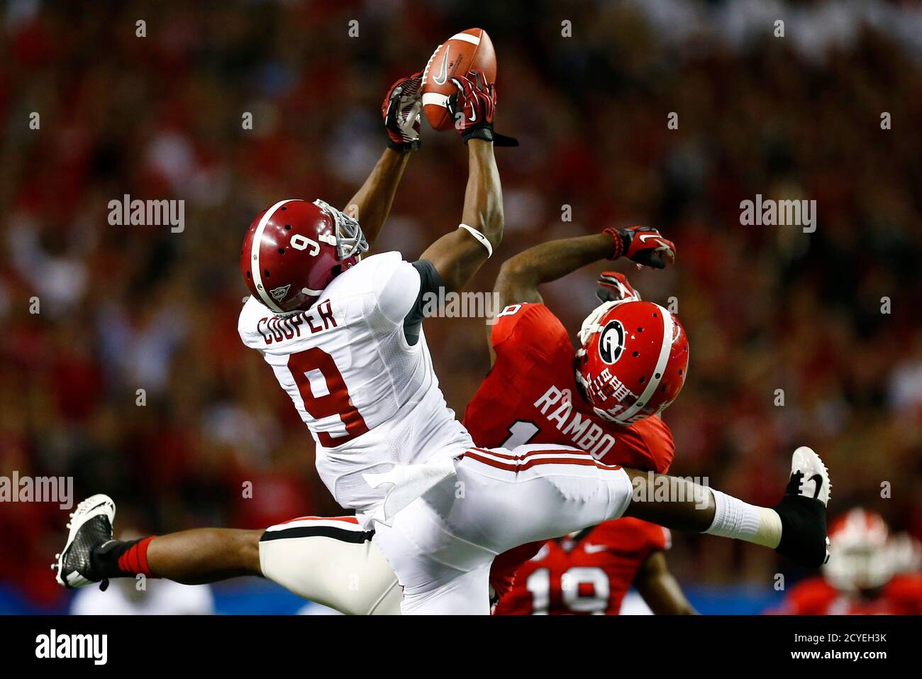 Alabama Wide Receiver Amari Cooper 9 Hangs On To A Pass Over The Defense Of Georgia Safety Bacarri Rambo 18 During The Second Quarter Of The Ncaa Sec College Football Championship In