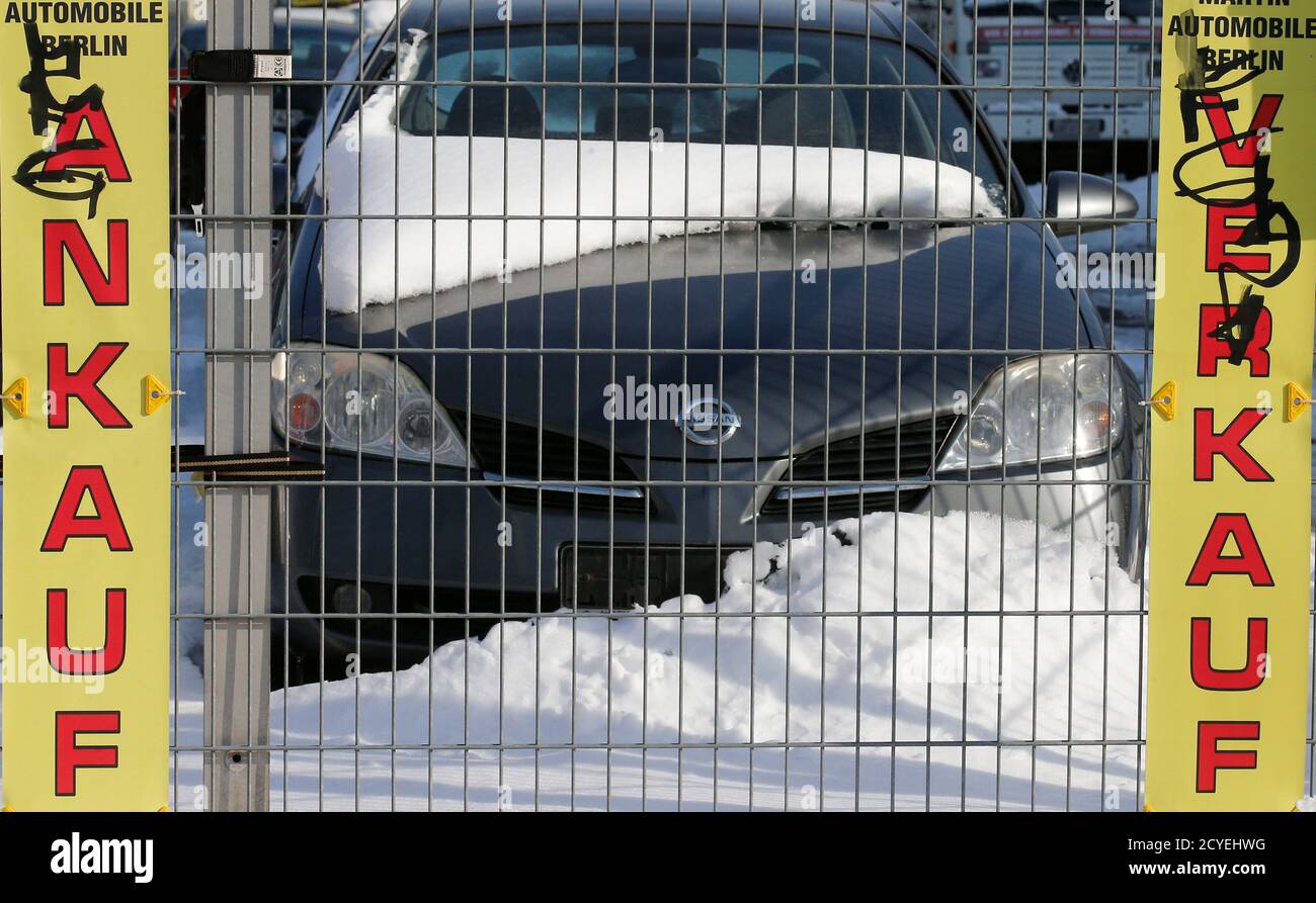 Piles Of Snow Are Seen Next To Parked Cars At The Yard Of A Car Dealer In Berlin S Weissensee District March 26 2013 The Chill In Cars Sales Has Spread From Southern