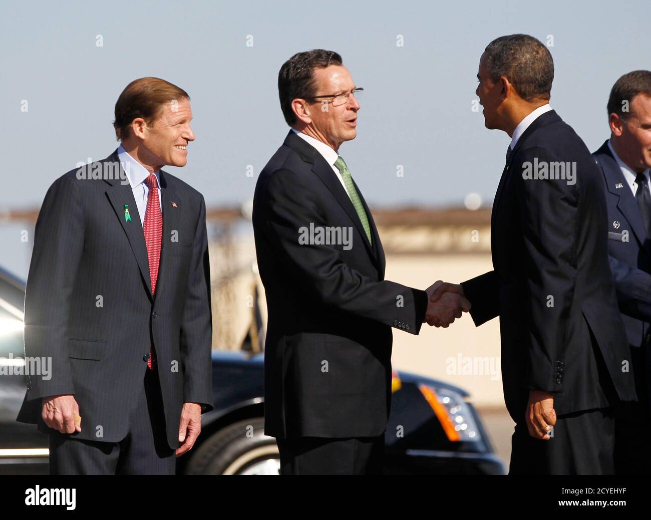 U.S. President Barack Obama (R) is greeted by Connecticut Governor Dannel Malloy (C) and Senator Richard Blumenthal upon his arrival at Bradley Air National Guard Base in Hartford, Connecticut, April 8, 2013. Obama is in Connecticut to deliver remarks on measures to reduce gun violence, at the University of Hartford.  REUTERS/Jason Reed     (UNITED STATES - Tags: POLITICS) Stock Photo