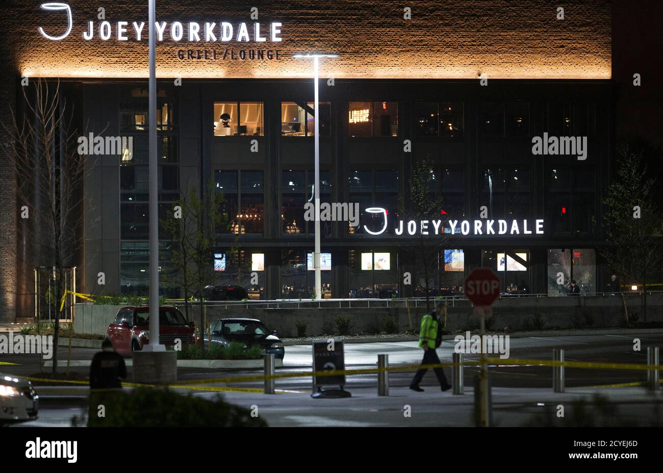 Security guards and police officers stand in front of the Joey Yorkdale restaurant where gunshots were fired at the Yorkdale shopping mall in Toronto May 11, 2013. One man has been sent to a local hospital with injuries following the incident, local media said.  REUTERS/Mark Blinch (CANADA - Tags: CRIME LAW) Stock Photo