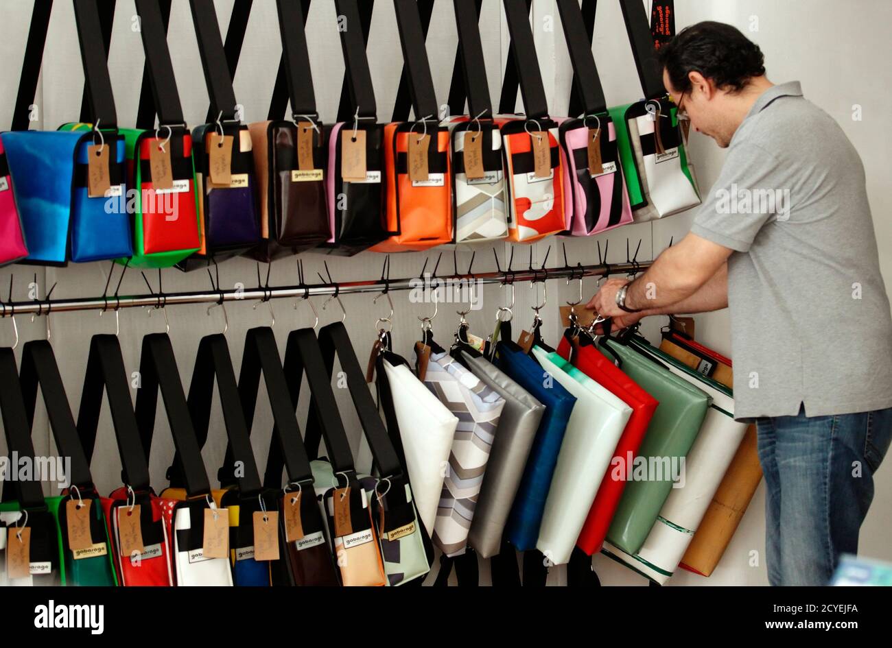 An Employee Sorts Bags Made From Used Canvases At The Shop Of Austrian Design Label Gabarage In Vienna June 13 13 Recovering Drug Addicts Are Powering The Company That Aims To Salvage