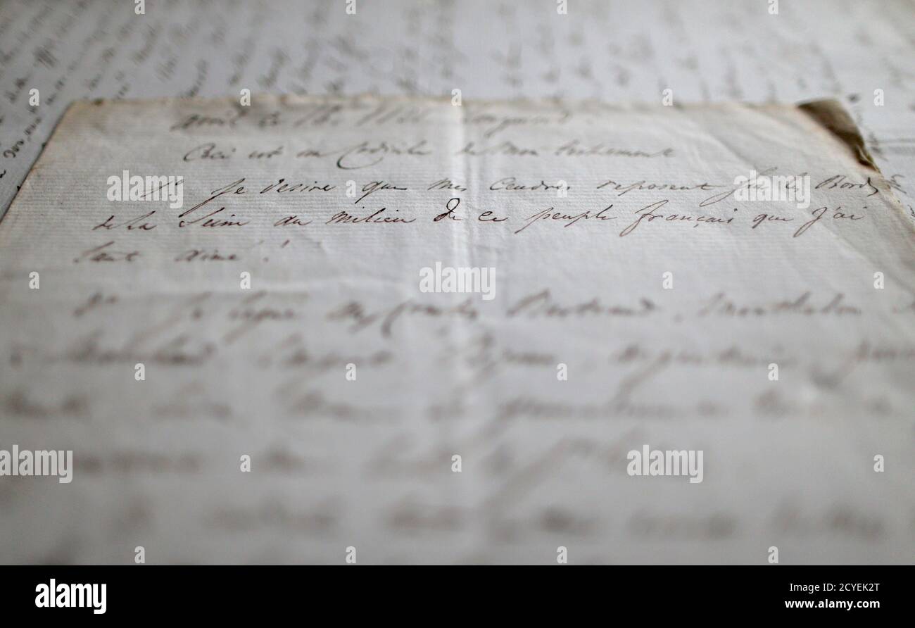 Two documents coming from a private collection of eight codicils dictated by the incapacitated late French Emperor Napoleon to an aide weeks before his death are displayed in Paris, September 26, 2013. The sentence on the pictured document reads 'I wish my ashes to be brought back to France to be interred on the banks of the River Seine, among the French people which I loved so much'. Following his defeat at the Battle of Waterloo, Napoleon was exiled to the remote South Atlantic island of St Helena where he lived out his days and died on May 5, 1821. The documents to be auctioned come from a  Stock Photo