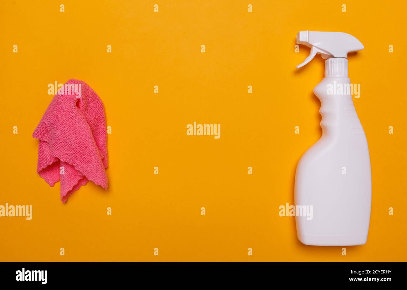 rag for cleaning and a black bottle with a glass cleaner. place for text. Stock Photo