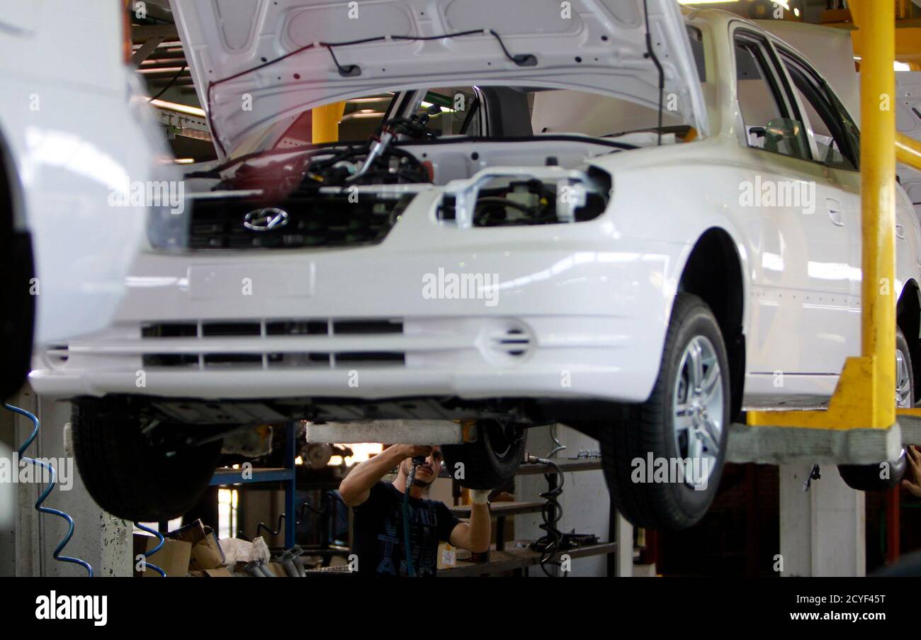 A Man Works In An Assembly Line Of Hyundai Cars In Egypt S Biggest Car Assembler Gb Auto In Cairo September 10 2013 Gb Auto Is Having To Adjust Its Relationship With Hyundai