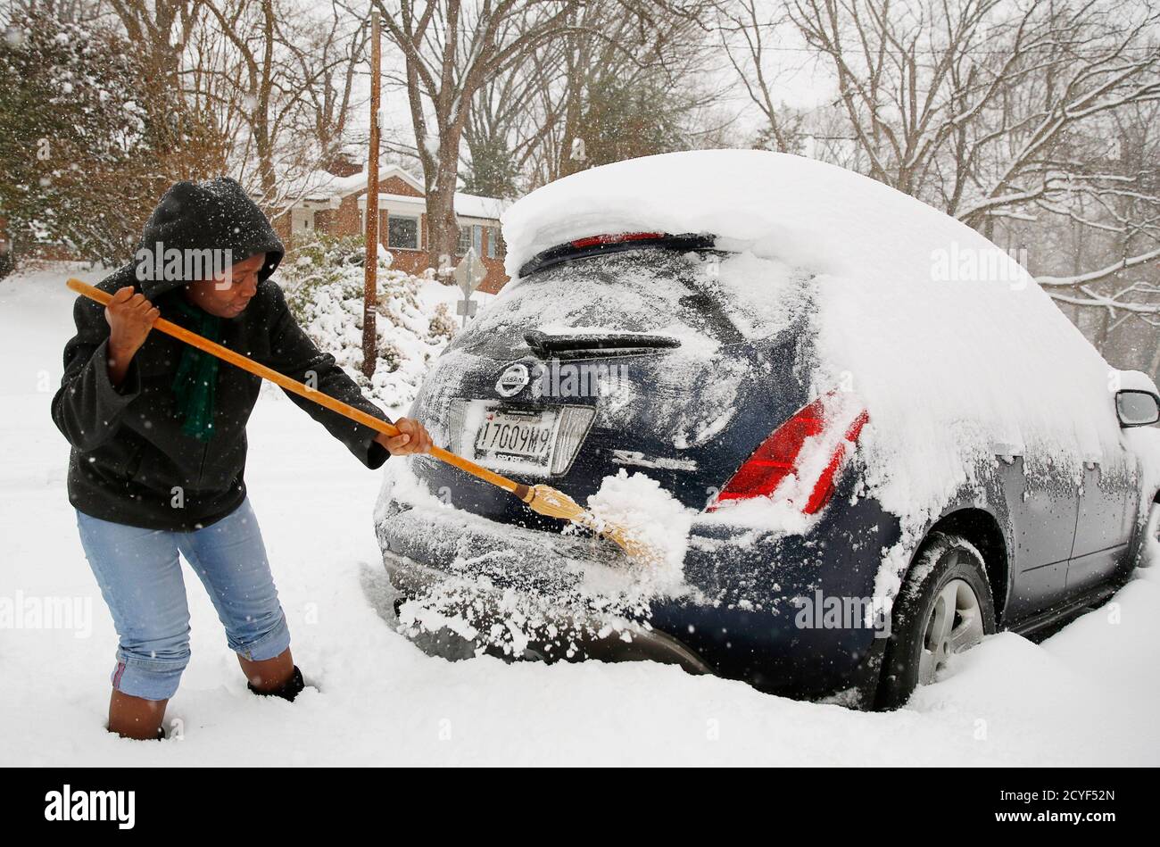 Oretha Bailey Clears Her Car Of Snow In Silver Spring Maryland February 13 2014 A Deadly And Intensifying Winter Storm Packing Heavy Snow Sleet And Rain Pelted A Huge Swath Of The