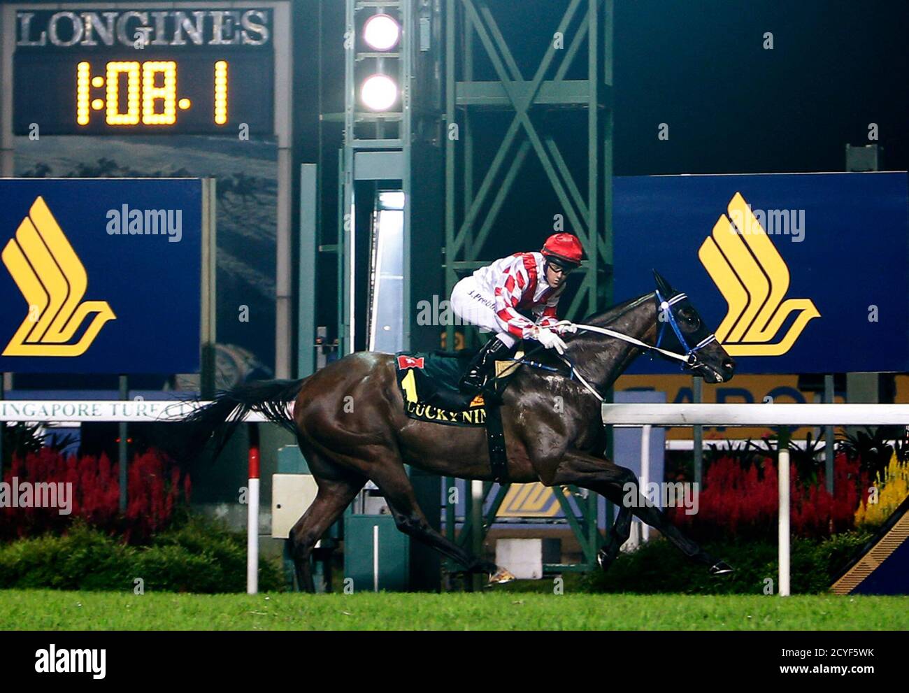 Brett Leonard Prebble rides Lucky Nine to victory during the KrisFlyer International Sprint horse race at the Singapore Turf Club May 18, 2014. REUTERS/Edgar Su (SINGAPORE - Tags: SPORT HORSE RACING) Stock Photo