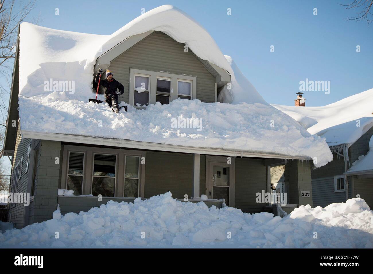 A Man Clears His Roof Of Snow In Buffalo New York November 21 2014 Warm Temperatures