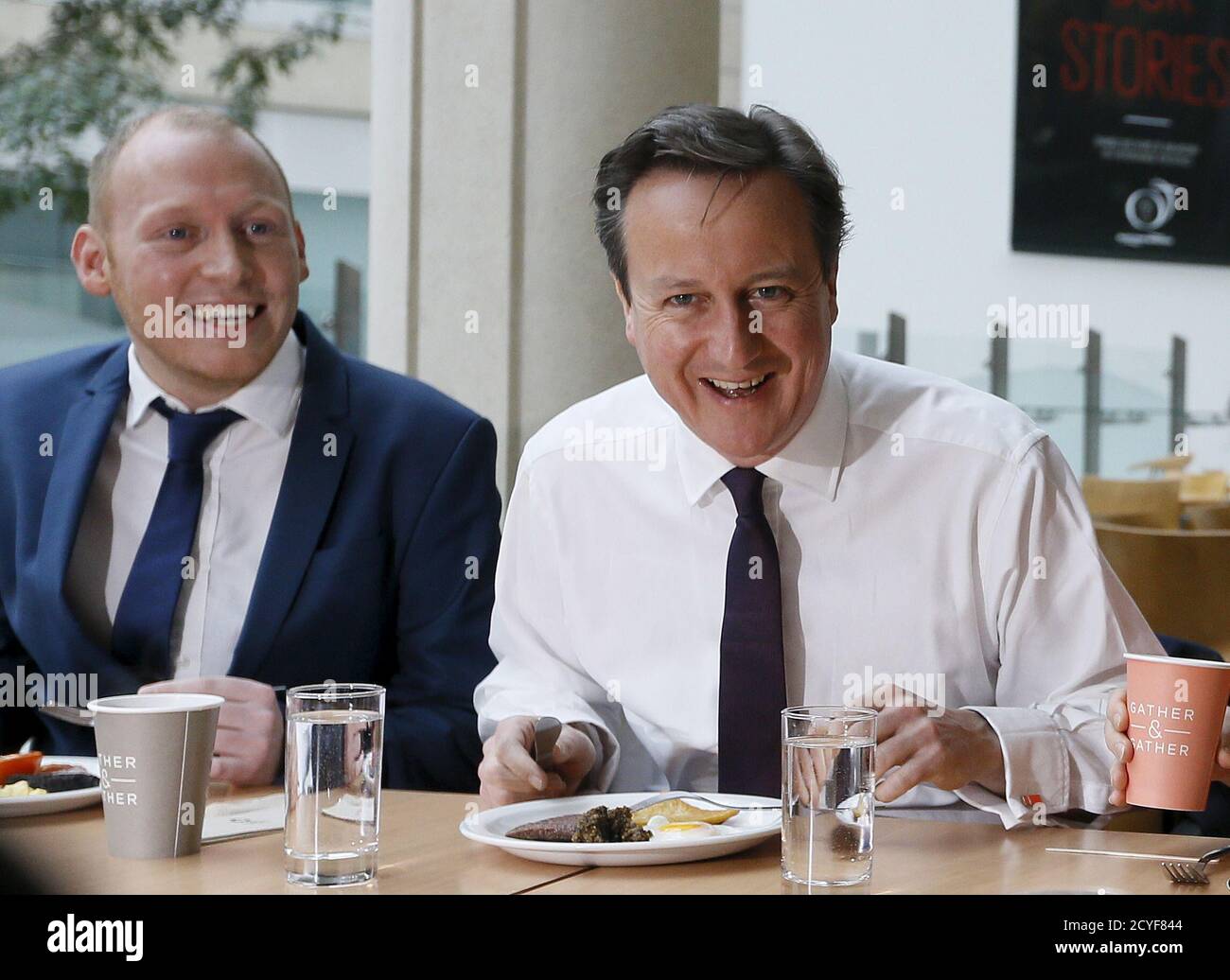 Britain's Prime Minister David Cameron eats breakfast during a visit to financial firm Scottish Widows in Edinburgh, Scotland April 7, 2015. REUTERS/Kirsty Wigglesworth/Pool Stock Photo