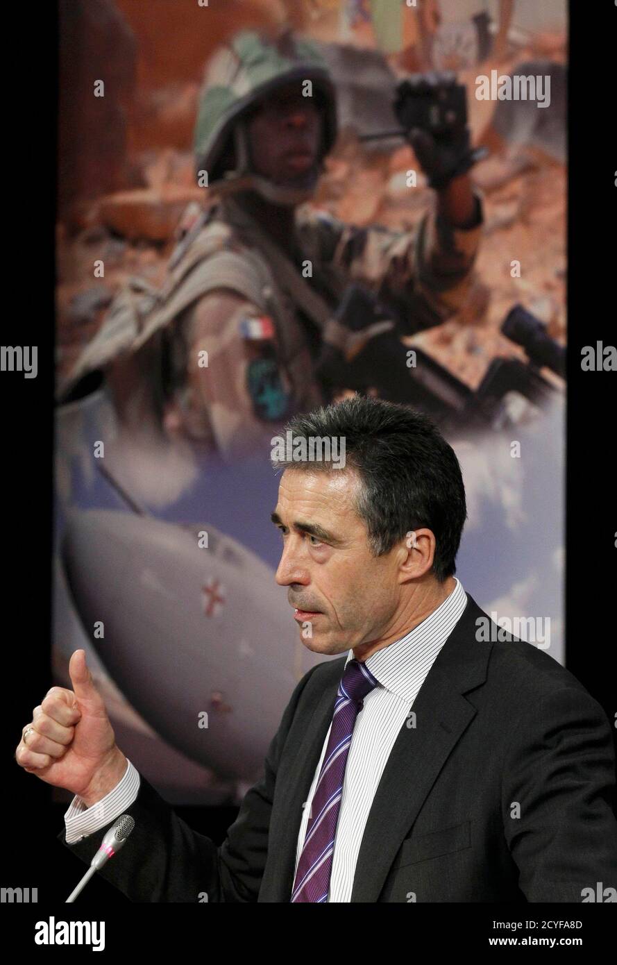 NATO Secretary General Anders Fogh Rasmussen holds a news conference during a NATO defence ministers meeting (NAC) at the Alliance headquarters in Brussels March 10, 2011. NATO defence ministers meeting in Brussels on Thursday and Friday will discuss options to respond to the turmoil in Libya, including a possible no-fly zone, the officials said.      REUTERS/Yves Herman (BELGIUM - Tags: POLITICS CIVIL UNREST MILITARY) Stock Photo