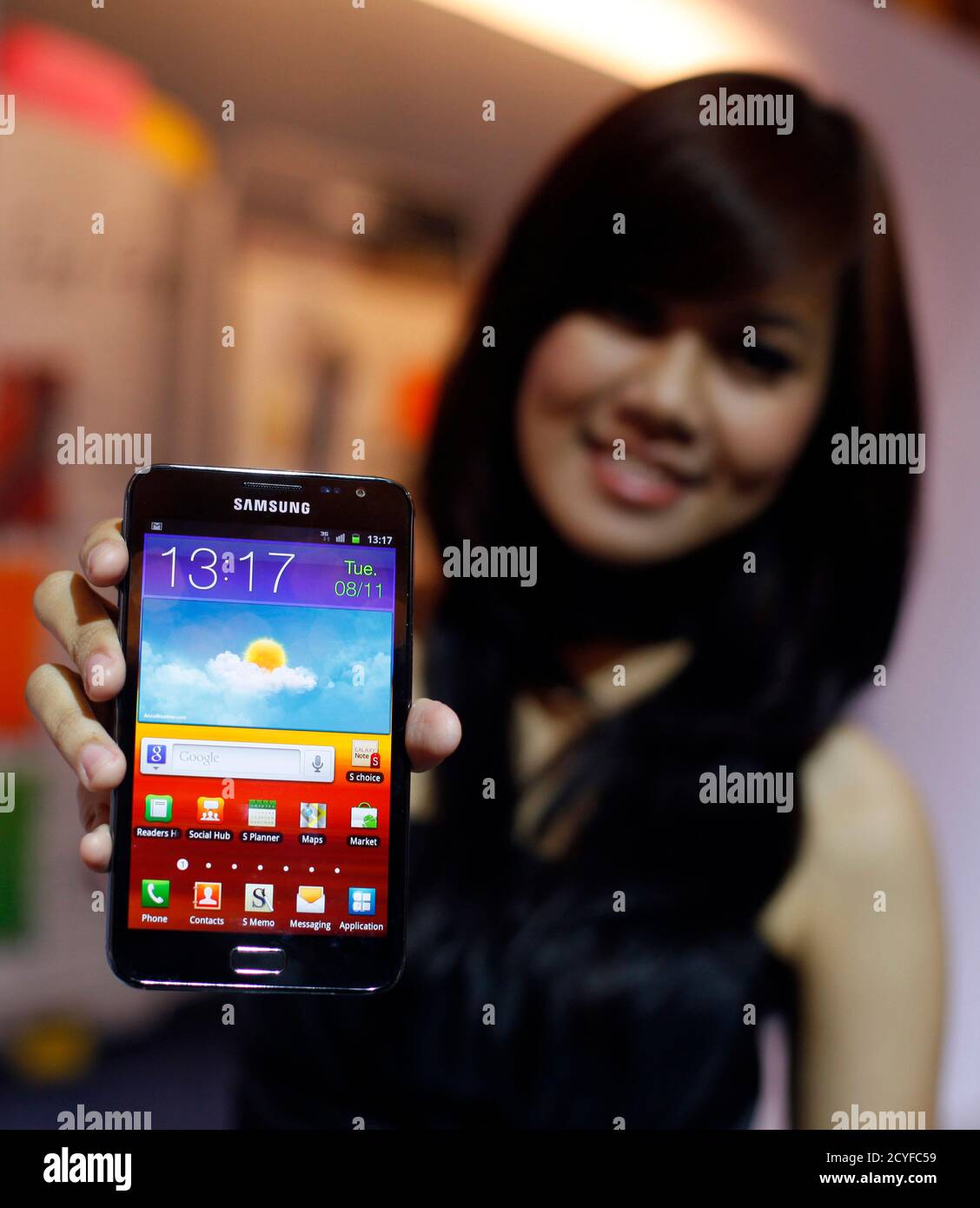 A promoter displays a Samsung Note android phone during its launch in  Jakarta November 8, 2011. The Samsung Note android phone will be available  on the market in Vietnam, Malaysia, Indonesia, Singapore,