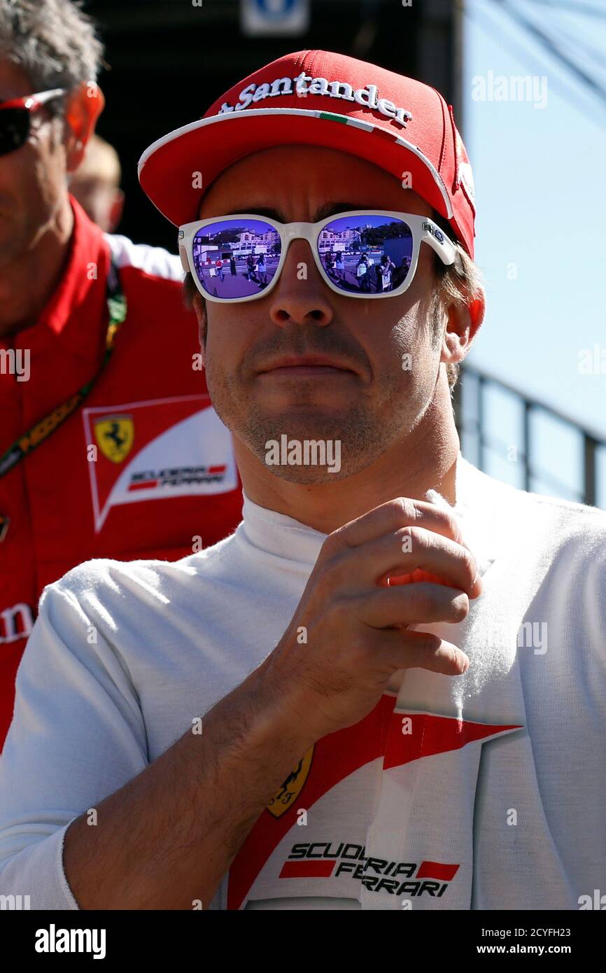 People are reflected in the sunglasses of Ferrari Formula One driver  Fernando Alonso of Spain ahead of the Monaco F1 Grand Prix May 26, 2013.  REUTERS/Benoit Tessier (MONACO - Tags: SPORT MOTORSPORT