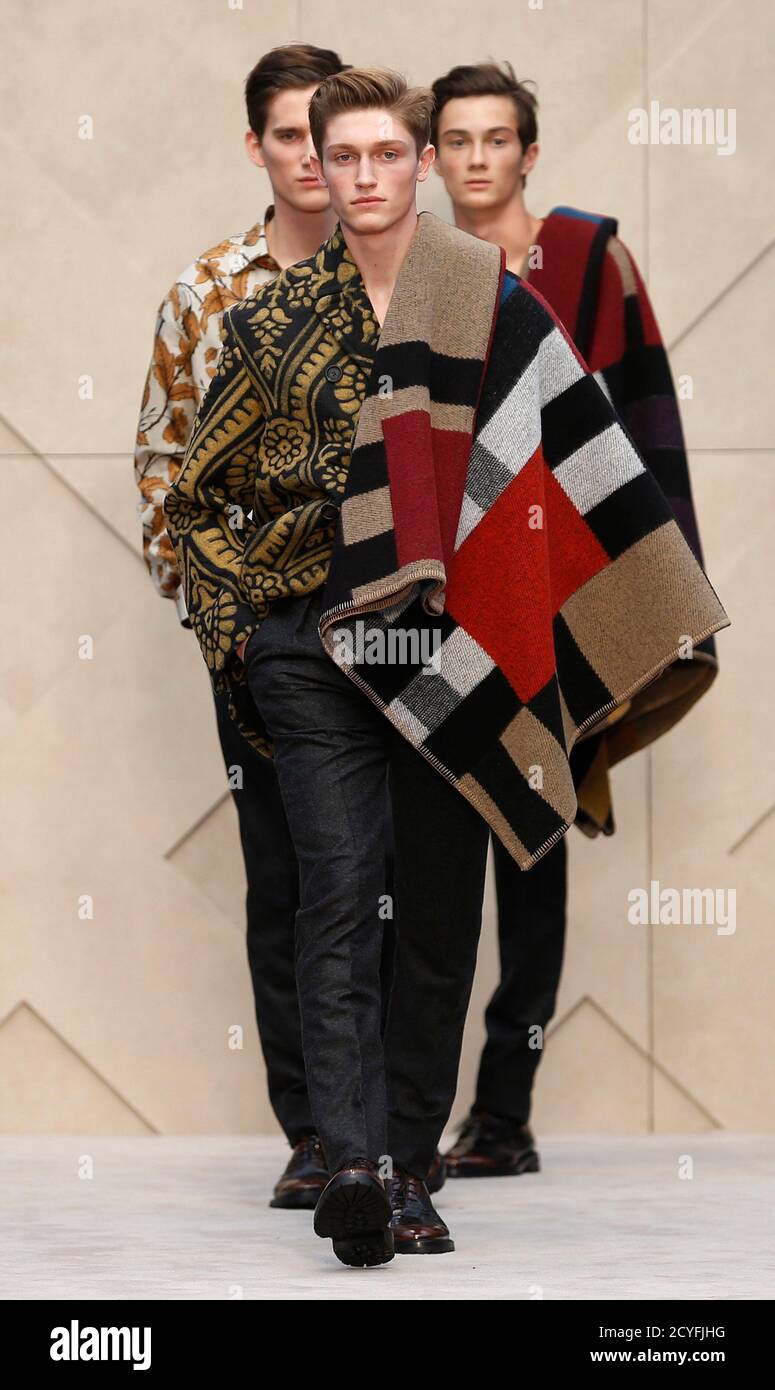Models present creations from the Burberry Prorsum Autumn/Winter 2014  collection during 