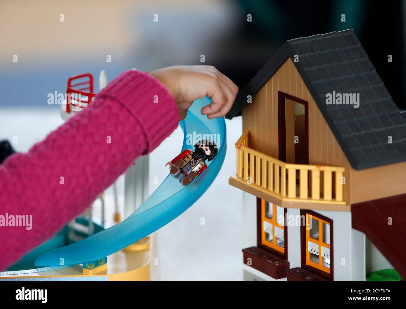 A child plays with a Playmobil figure at the Playmobil FunPark, adjacent to  the Playmobil Malta factory in the Hal Far Industrial Estate outside  Valletta April 14, 2014. Playmobil is celebrating its