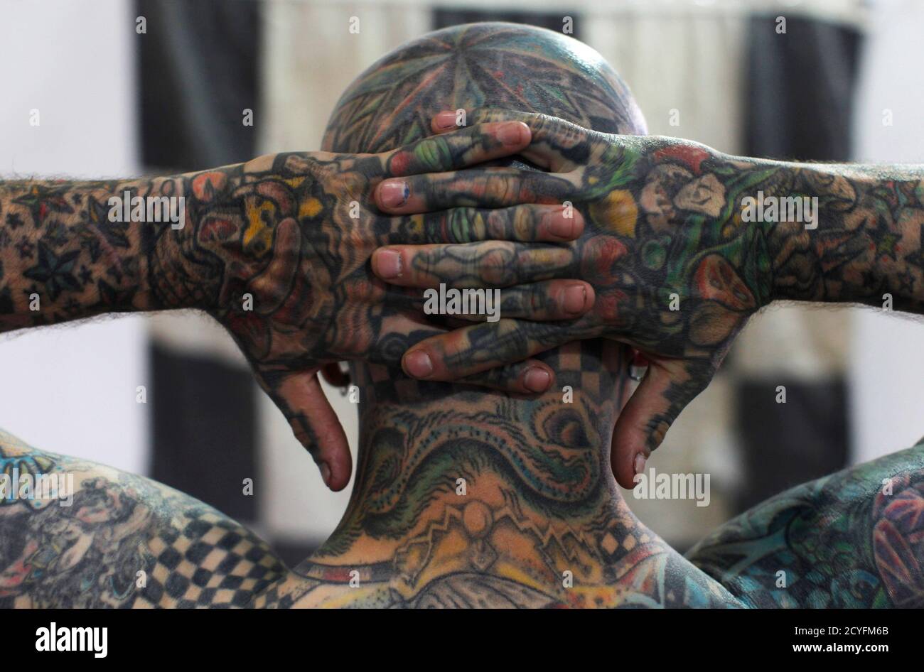 Matt Gone, also known as "The Checkered Man" poses during the GuateMayan  Tattoo Convention in Guatemala City July 19, 2014. Gone claims to be one of  the most tattooed people in the