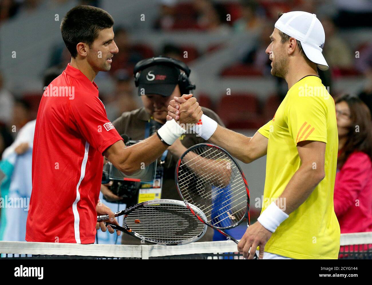 Serbia's Novak Djokovic (L) shakes hands with Austria's Jurgen Melzer after  their quarter final men's singles match at the China Open tennis tournament  in Beijing October 5, 2012. REUTERS/David Gray (CHINA -