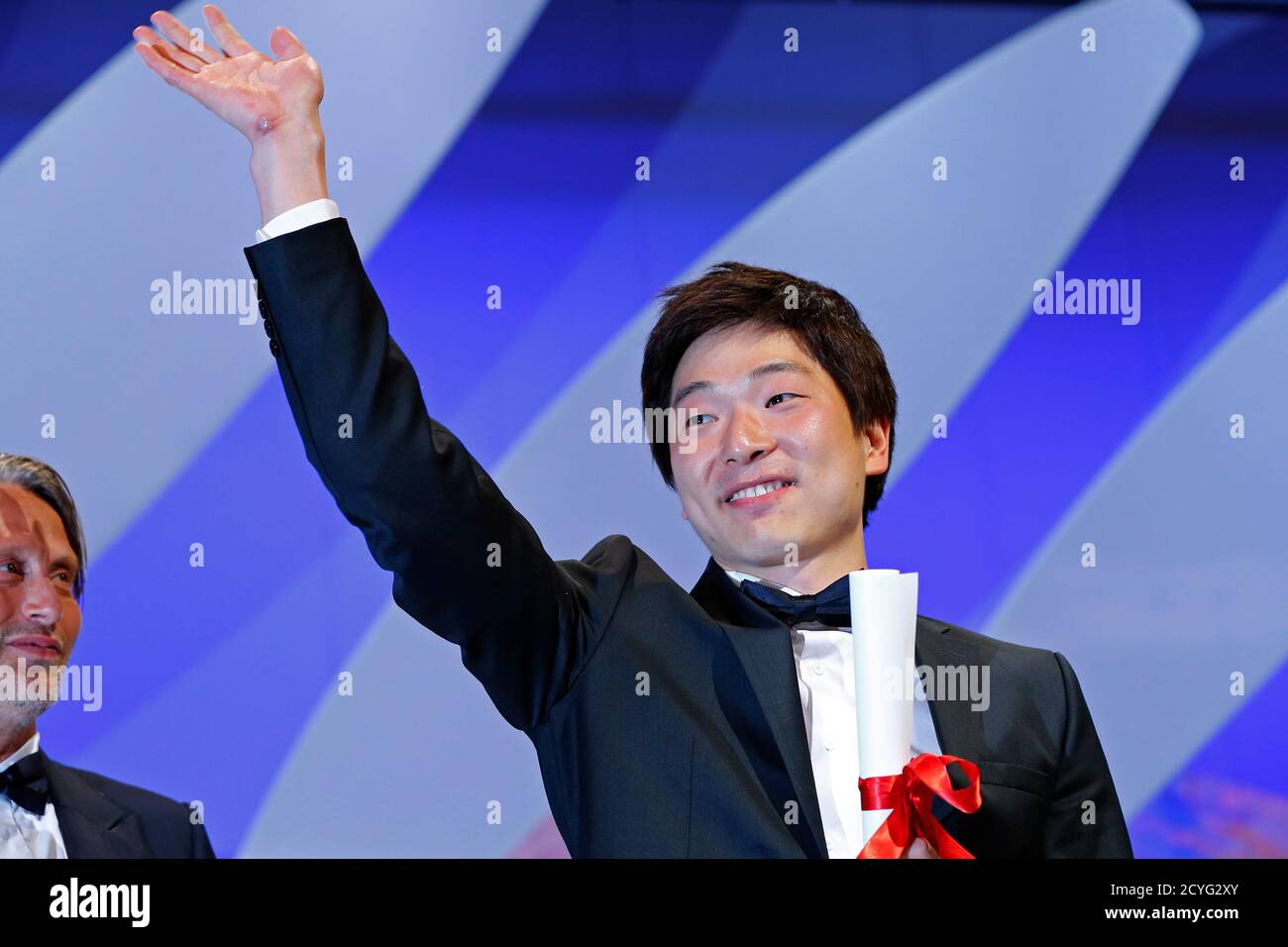 Director Moon Byoung-Gon, Short film Palme d'Or award winner for the film " Safe", celebrates on stage after being awarded during the closing ceremony  of the 66th Cannes Film Festival in Cannes May