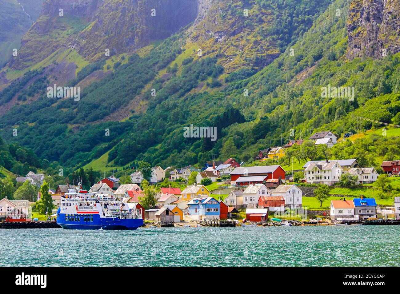 Ferry in colorful Undredal village Aurlandsfjord Aurland Vestland Sognefjord in Norway. Stock Photo