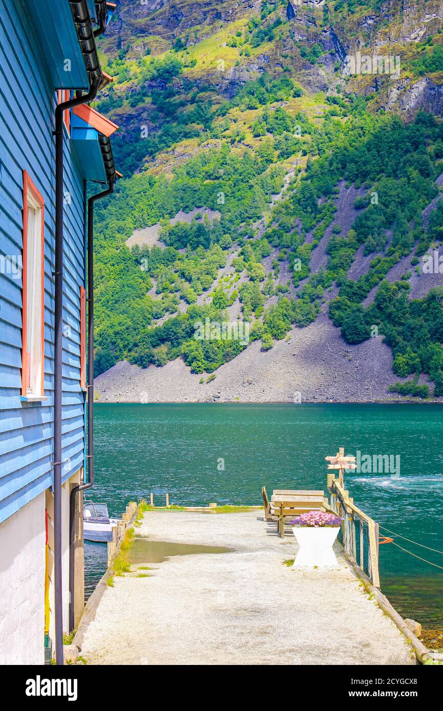 Colorful wooden houses and architecture by the pier in Undredal village Aurlandsfjord Aurland Vestland Sognefjord in Norway. Stock Photo