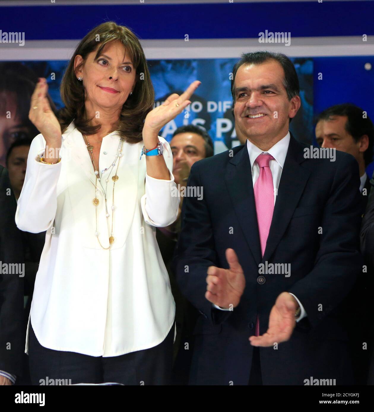 Presidential candidate Oscar Ivan Zuluaga (R) and former candidate Marta Lucia  Ramirez clap during an event in Bogota May 28, 2014. Ramirez, who came  third in Colombia's presidential election on Sunday, threw