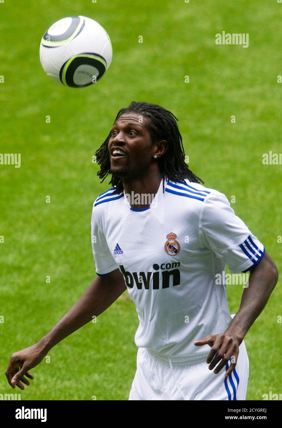 Real Madrid's new player Emmanuel Adebayor heads the ball during his  presentation at the Santiago Bernabeu stadium in Madrid January 27, 2011.  Real signed Adebayor from Manchester City on loan until the