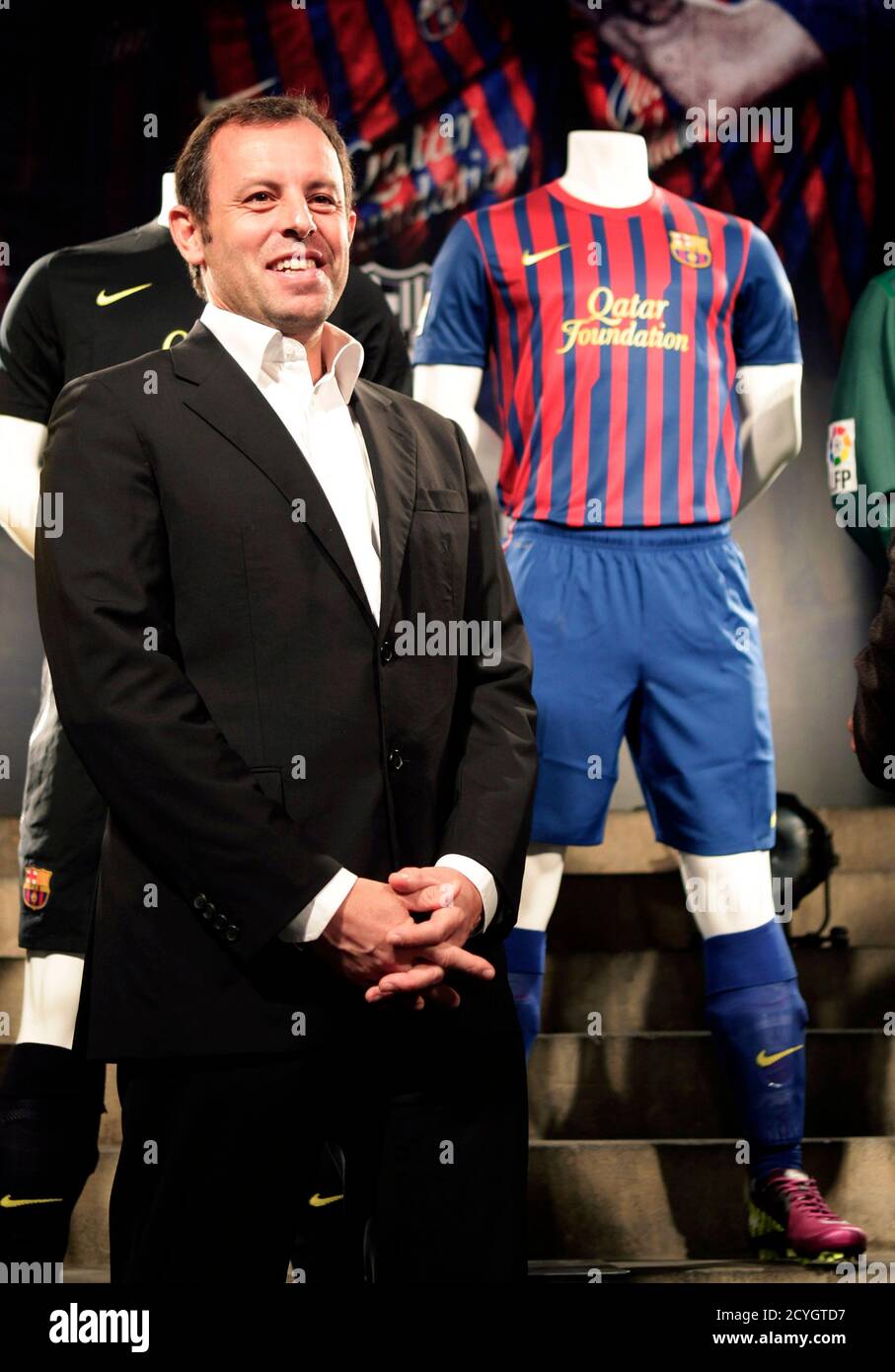 Barcelona S President Sandro Rosell Poses With The New Barcelona Jersey For The 2011 2012 Season With The Qatar Foundation Logo During Its Presentation At Camp Nou Stadium In Barcelona May 17 2011 Reuters Albert