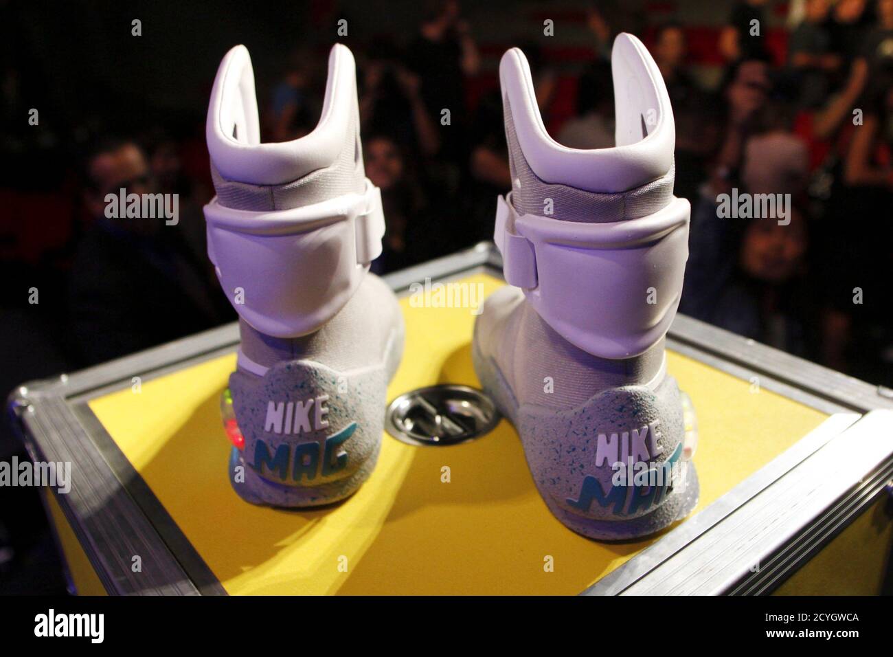 A pair of 2011 NIKE MAG shoes, based on the original NIKE MAG worn in 2015  by the "Back to the Future" character Marty McFly, played by Michael J.  Fox, is displayed