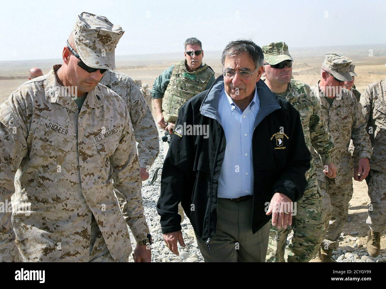 U.S. Defense Secretary Leon Panetta is greeted by Col. John Shafer (L) with RTC 6 after arriving to greet troops at Forward Operating Base Shukvani, Afghanistan March 14, 2012. Panetta told troops in Afghanistan on Wednesday that the massacre of 16 Afghan civilians by an American soldier should not deter them from their mission to secure the country ahead of a 2014 NATO withdrawal deadline.  REUTERS/Scott Olson/Pool  (AFGHANISTAN - Tags: POLITICS MILITARY) Stock Photo