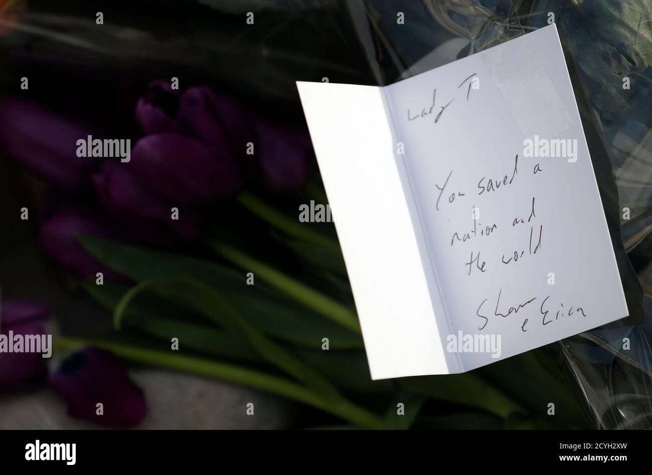 A Note And Floral Tribute Is Seen After It Was Placed Outside The Home Of Former