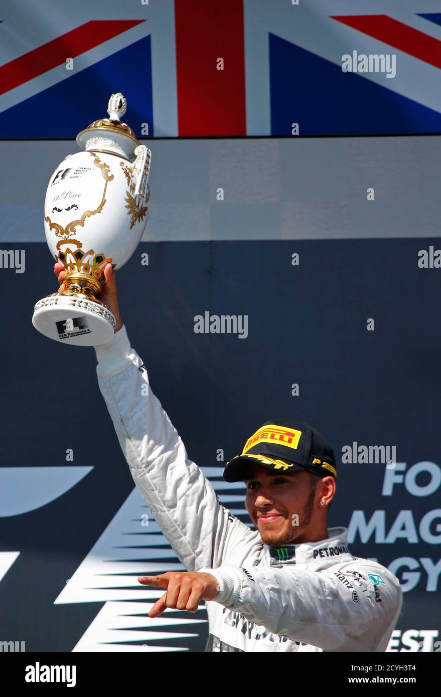 Mercedes Formula One Driver Lewis Hamilton Of Britain Holds Up His Trophy On The Podium After Winning The Hungarian F1 Grand Prix At The Hungaroring Circuit In Mogyorod Near Budapest July 28